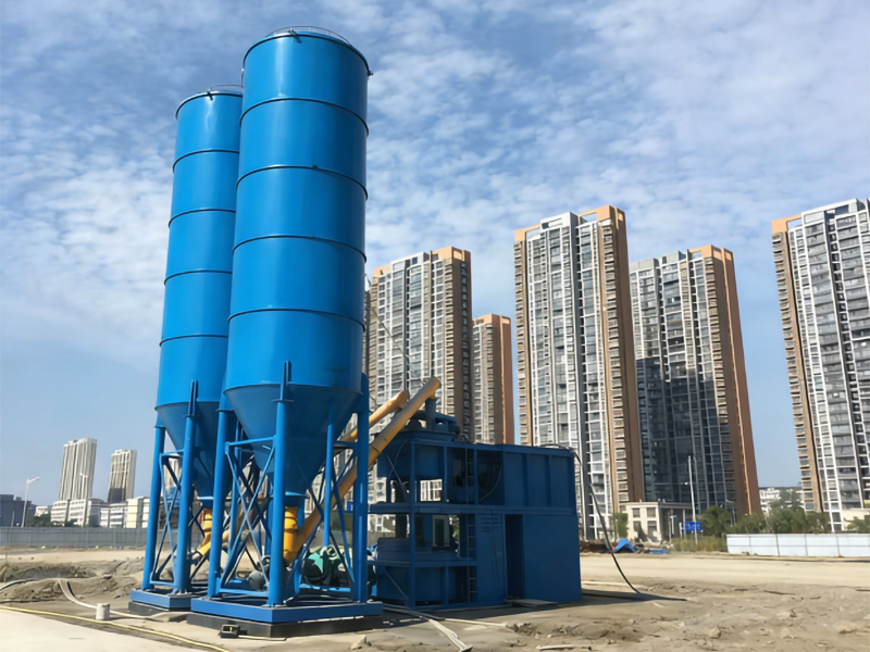 Operator flushing mixer and conveyor of an automated cement grout plant at shift end, Eizoo Machinery